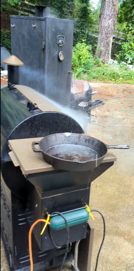 smoking meat in the rain is OK but be sure your electrical connections are safe